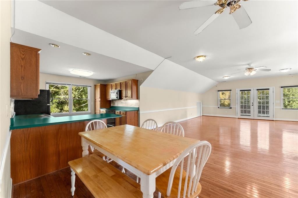 749 Hubert Pittman Road Pendergrass, GA 30567 - Photo 40 of 49 a view of a dining room with furniture window and wooden floor