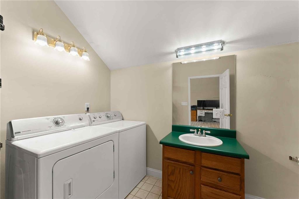 749 Hubert Pittman Road Pendergrass, GA 30567 - Photo 43 of 49 a bathroom with a sink a toilet and mirror