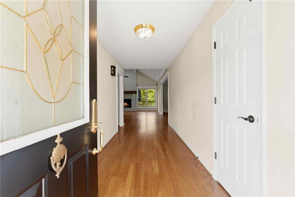 749 Hubert Pittman Road Pendergrass, GA 30567 - Photo 5 of 49 a view of a hallway with wooden floor and entryway