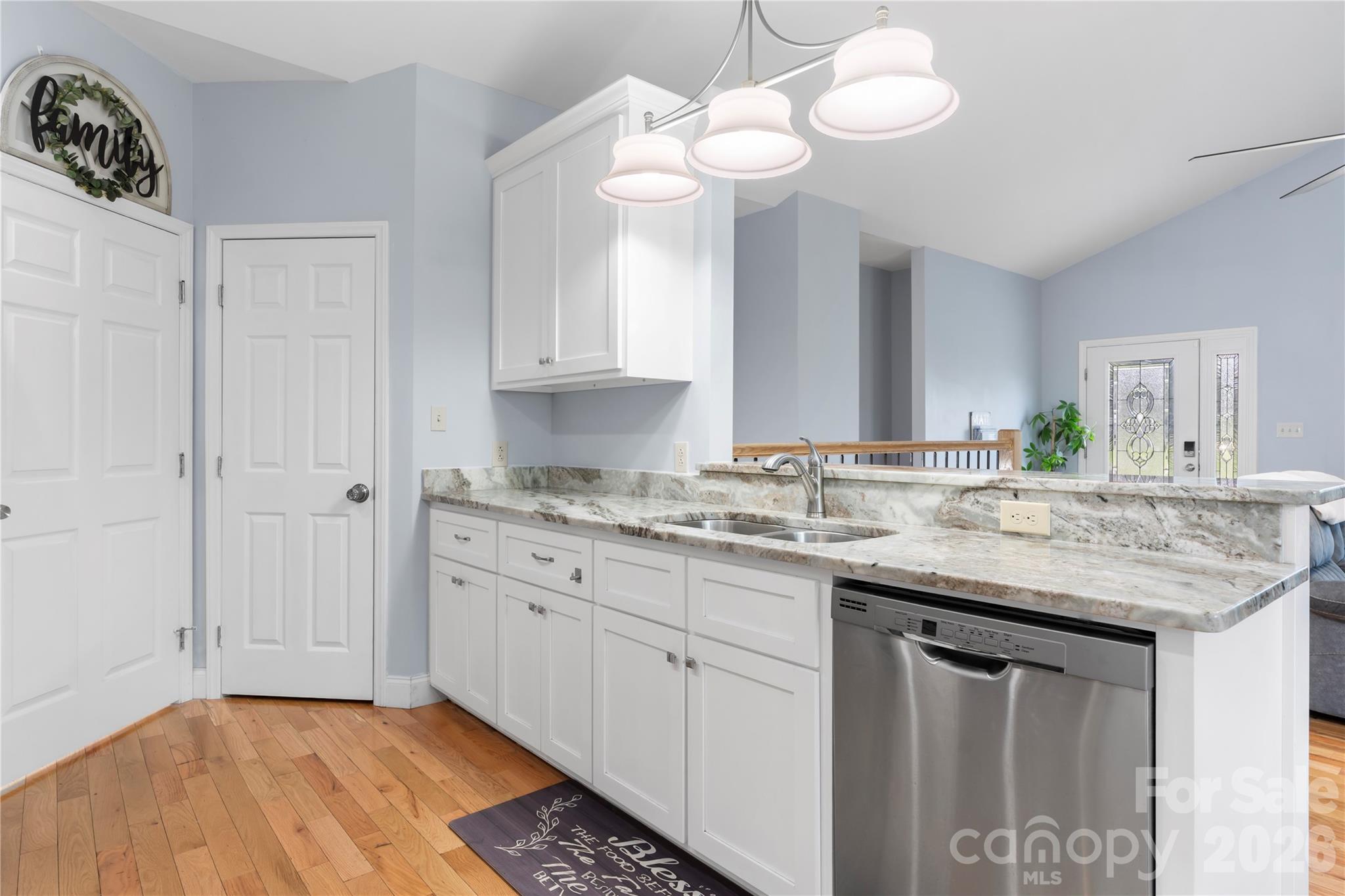 111 Pinewood Road Granite Falls, NC 28630 - Photo 11 of 33 a kitchen with granite countertop a sink cabinets and window