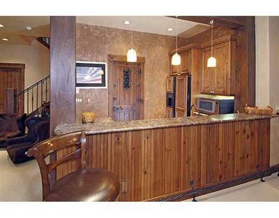 301 Eagle River Road Edwards, CO 81632 - Photo 13 of 20 a kitchen with stainless steel appliances granite countertop a sink and cabinets