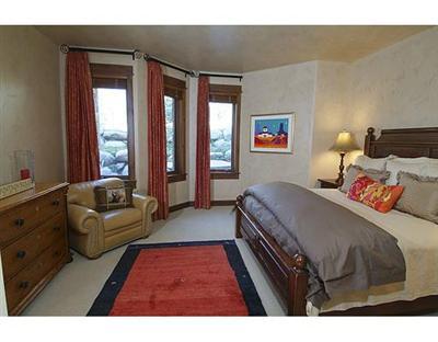 301 Eagle River Road Edwards, CO 81632 - Photo 17 of 20 a bedroom with a bed and a couch