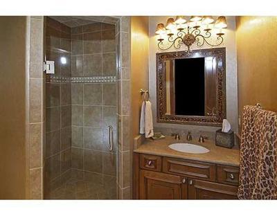 301 Eagle River Road Edwards, CO 81632 - Photo 18 of 20 a bathroom with a sink mirror and shower