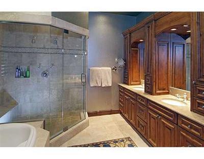 301 Eagle River Road Edwards, CO 81632 - Photo 5 of 20 a bathroom with a granite countertop sink a mirror and shower