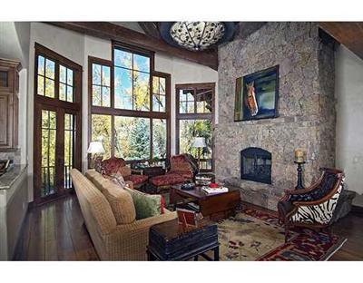 301 Eagle River Road Edwards, CO 81632 - Photo 6 of 20 a living room with furniture and a fireplace