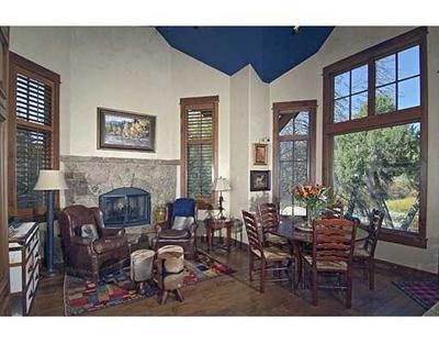 301 Eagle River Road Edwards, CO 81632 - Photo 7 of 20 a living room with furniture and a fireplace