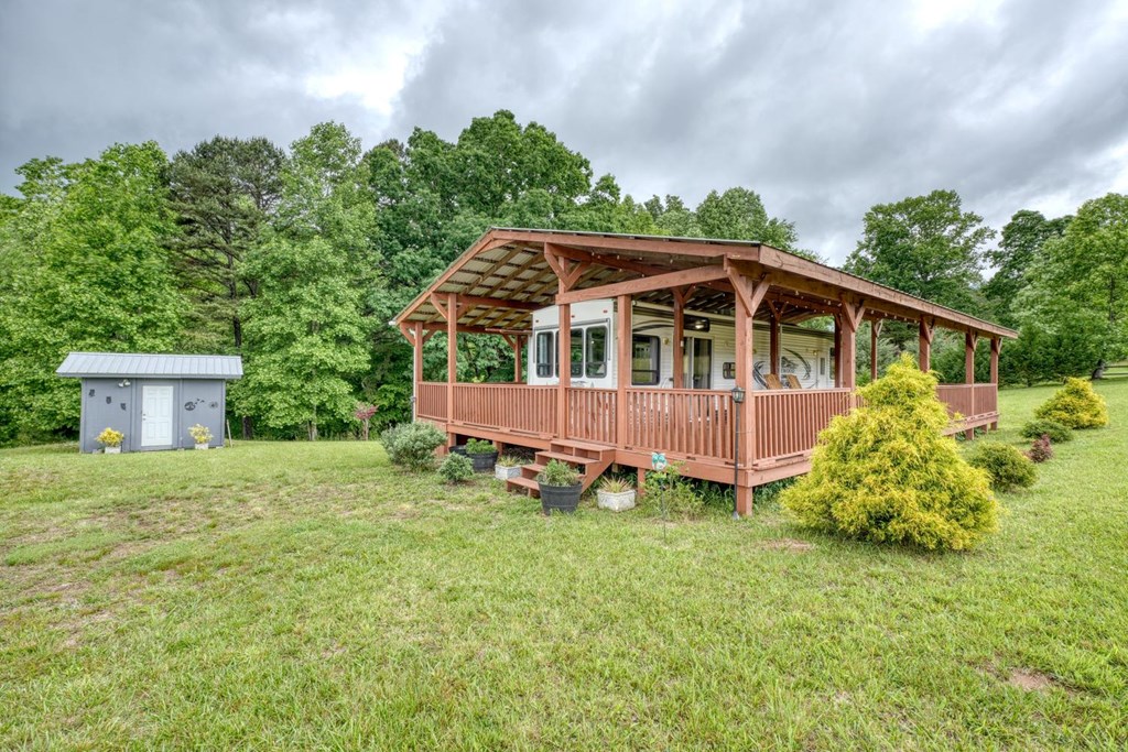 568 Parks Road Hiawassee, GA 30546 - Photo 28 of 38 a view of a house with a yard and sitting area