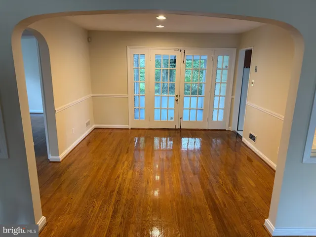 a view of a room with wooden floor and staircase