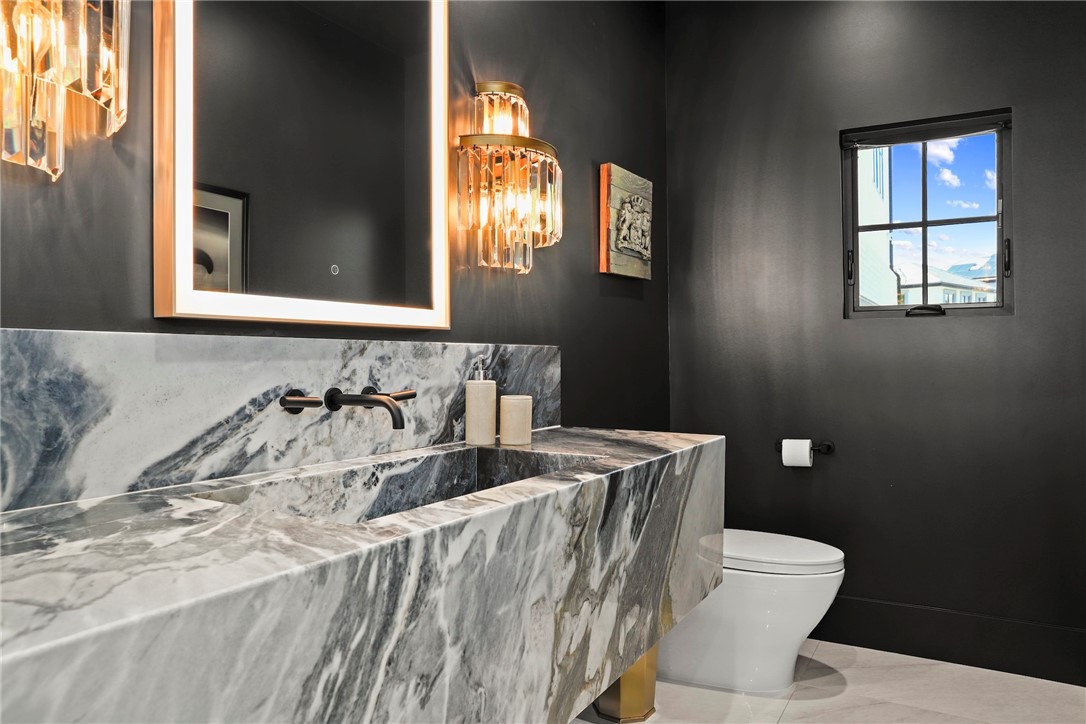 20630 Kingsboro Way Woodland Hills, CA 91364 - Photo 13 of 44 a bathroom with a sink and a mirror