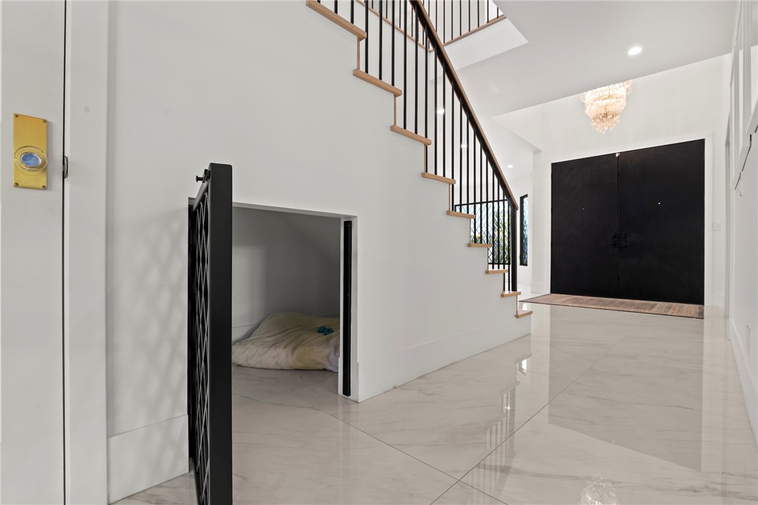 20630 Kingsboro Way Woodland Hills, CA 91364 - Photo 16 of 44 a view of hallway with stairs and wooden floor
