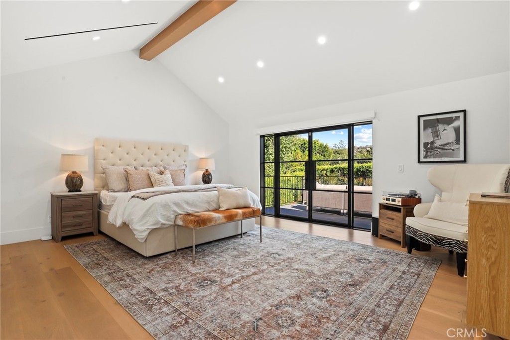 20630 Kingsboro Way Woodland Hills, CA 91364 - Photo 23 of 44 a bedroom with a bed and large window