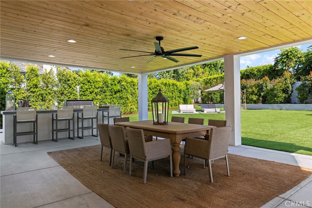 20630 Kingsboro Way Woodland Hills, CA 91364 - Photo 37 of 44 a dining room with furniture and garden view