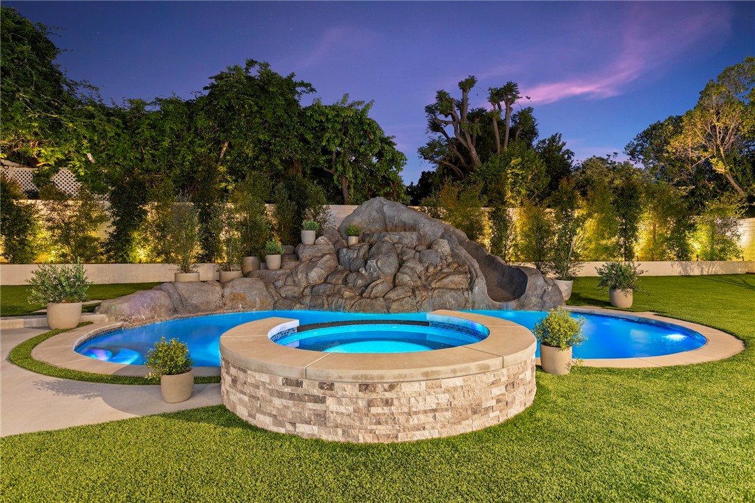 20630 Kingsboro Way Woodland Hills, CA 91364 - Photo 41 of 44 a view of a swimming pool with a yard
