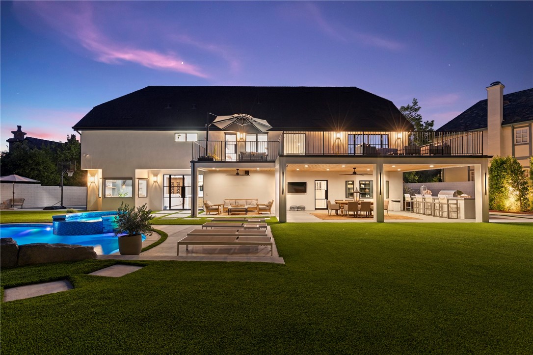20630 Kingsboro Way Woodland Hills, CA 91364 - Photo 42 of 44 a front view of a house with swimming pool yard fire pit and outdoor seating