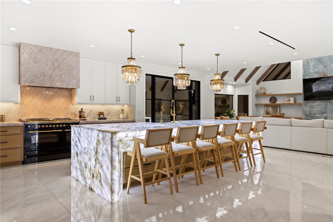 20630 Kingsboro Way Woodland Hills, CA 91364 - Photo 6 of 44 a large kitchen with a table and chairs