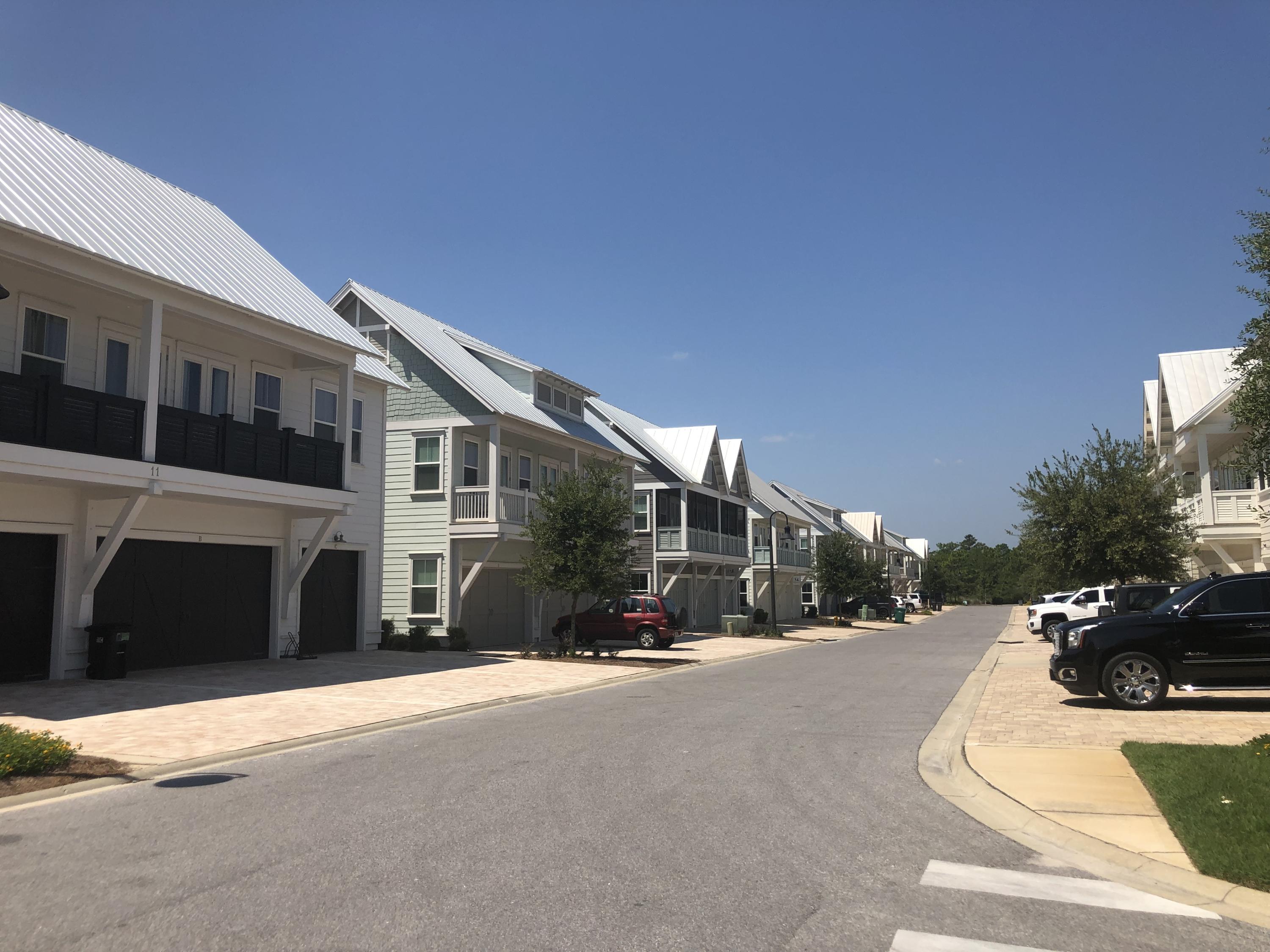 4 East Milestone Dr Inlet Beach, Unit 295C Inlet Beach, FL 32461 - Photo 2 of 23 a view of a street with a building in the background