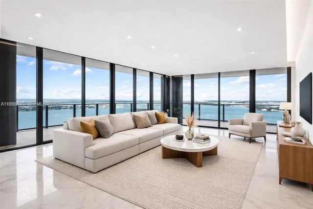 a spacious bathroom with a tub sink and mirror