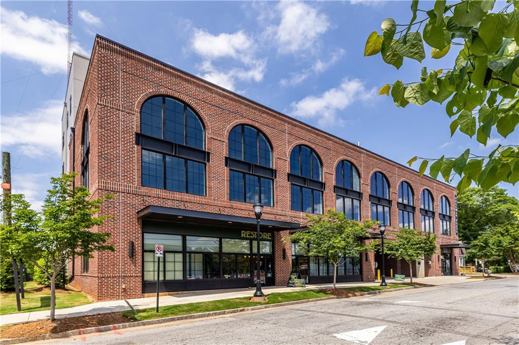 112 Rogers Street Southeast, Unit 208 Atlanta, GA 30307 - Photo 1 of 44 a front view of a building with street view