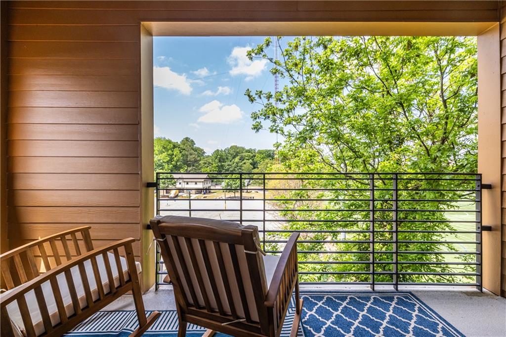 112 Rogers Street Southeast, Unit 208 Atlanta, GA 30307 - Photo 17 of 44 a view of a balcony with lake view
