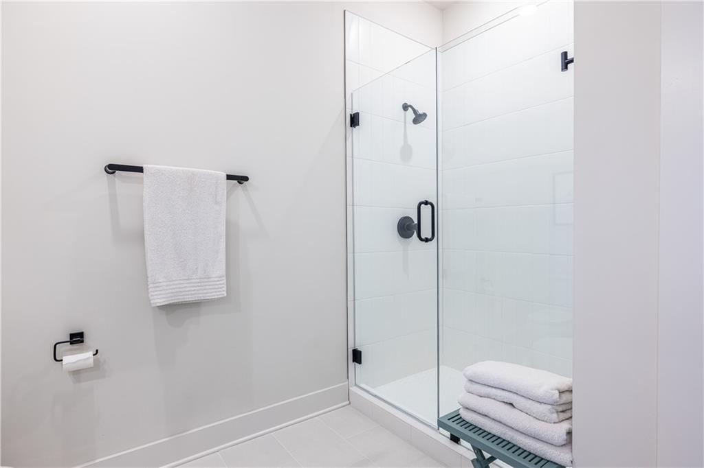 112 Rogers Street Southeast, Unit 208 Atlanta, GA 30307 - Photo 27 of 44 a bathroom with a shower