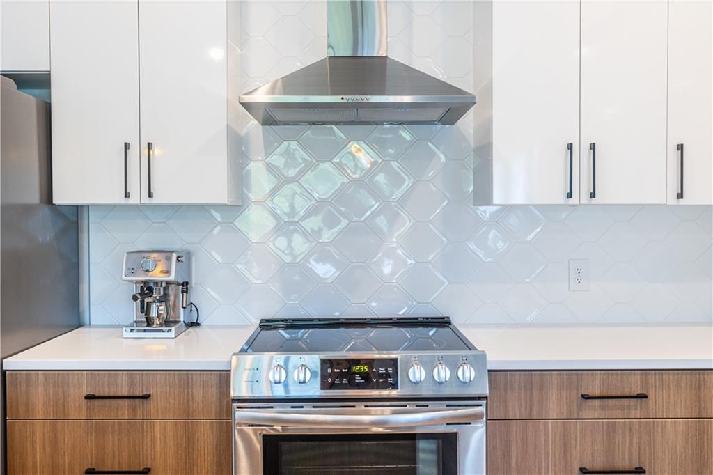 112 Rogers Street Southeast, Unit 208 Atlanta, GA 30307 - Photo 7 of 44 a stove top oven sitting inside of a kitchen