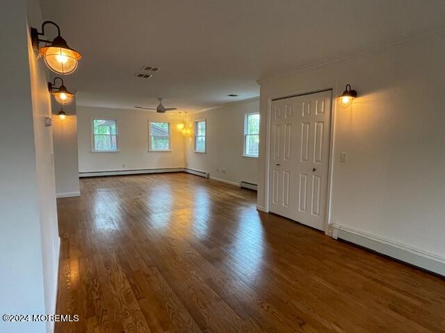 220 Folsom Drive Brick, NJ 08724 - Photo 12 of 51 an empty room with wooden floor and windows