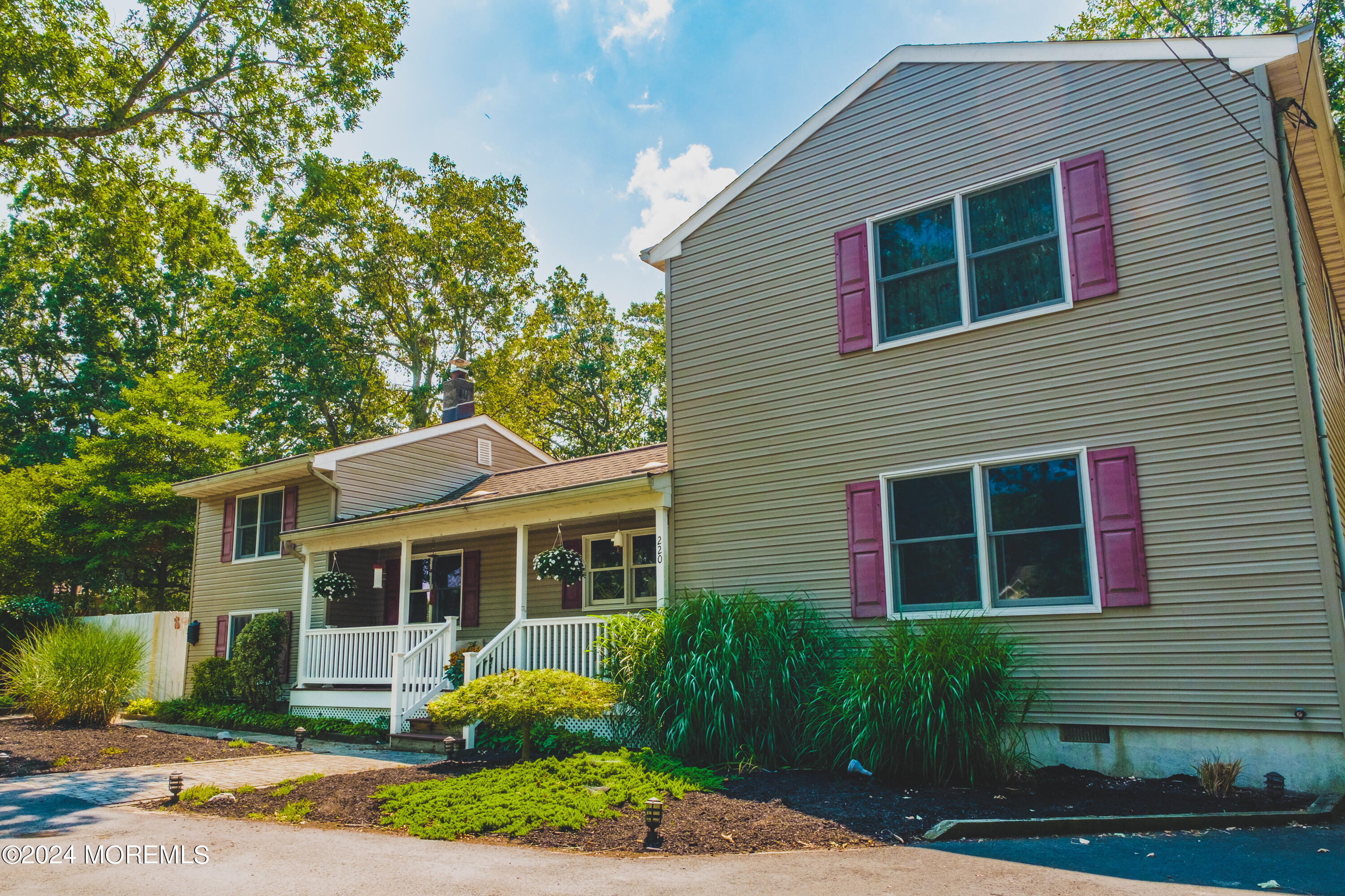 220 Folsom Drive Brick, NJ 08724 - Photo 2 of 51 a front view of a house with garden and porch