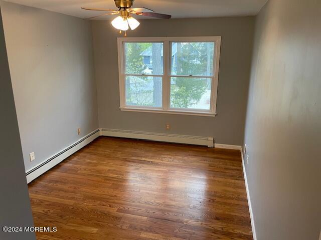 220 Folsom Drive Brick, NJ 08724 - Photo 27 of 51 an empty room with wooden floor and windows