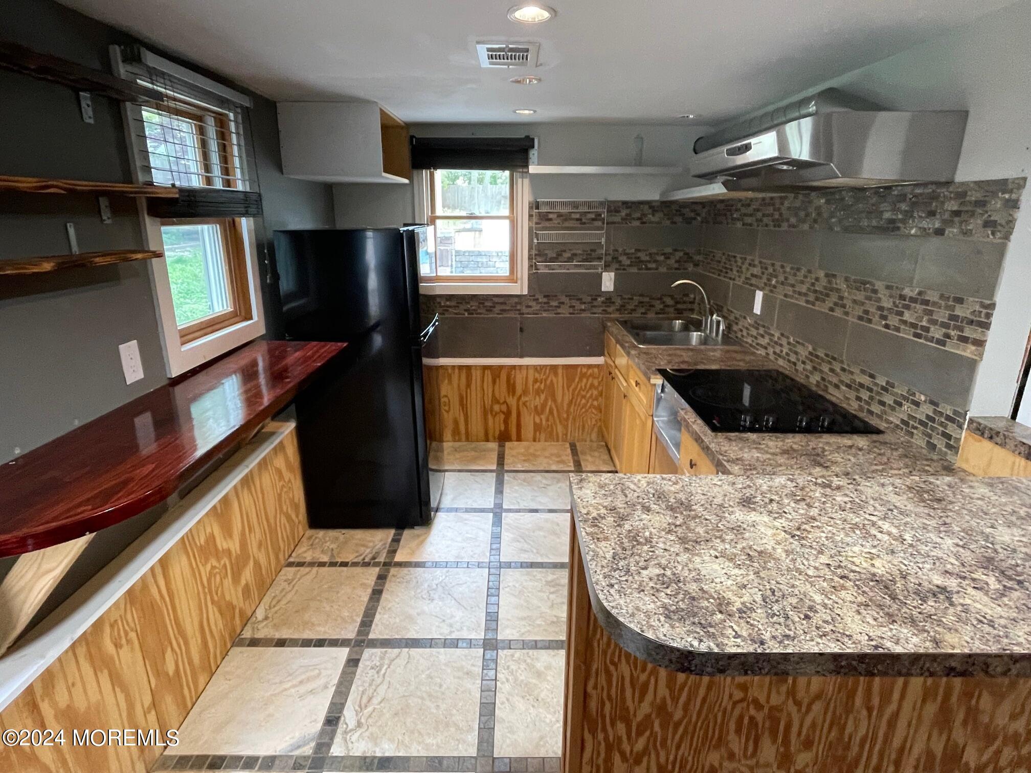220 Folsom Drive Brick, NJ 08724 - Photo 34 of 51 a kitchen with a sink and a stove