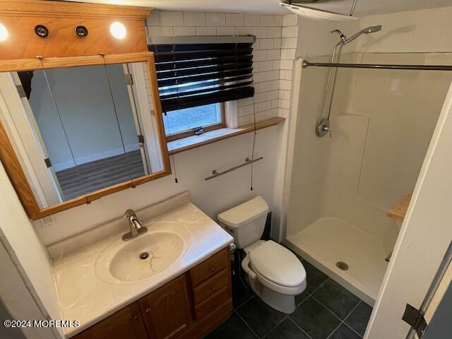 220 Folsom Drive Brick, NJ 08724 - Photo 42 of 51 a bathroom with a sink a toilet and shower