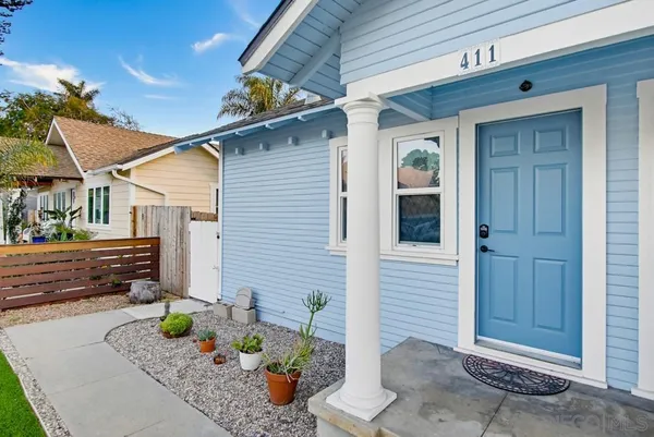 a front view of a house with seating space