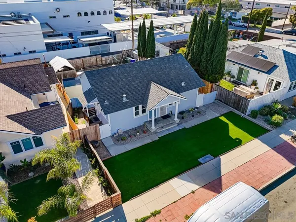 an aerial view of a houses with yard