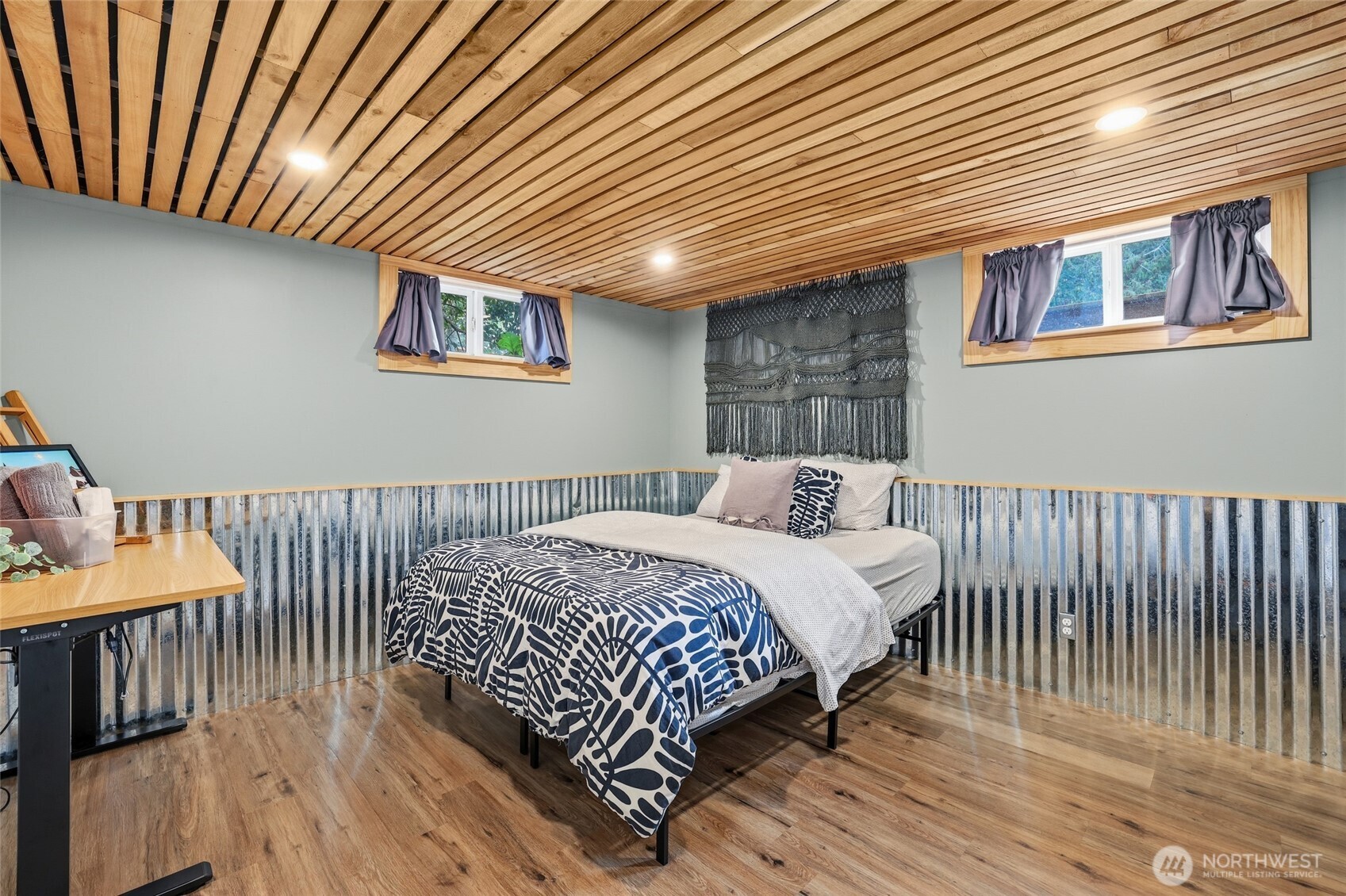 11406 12th Avenue Southwest Seattle, WA 98146 - Photo 17 of 30 a bedroom with a bed and wooden floor