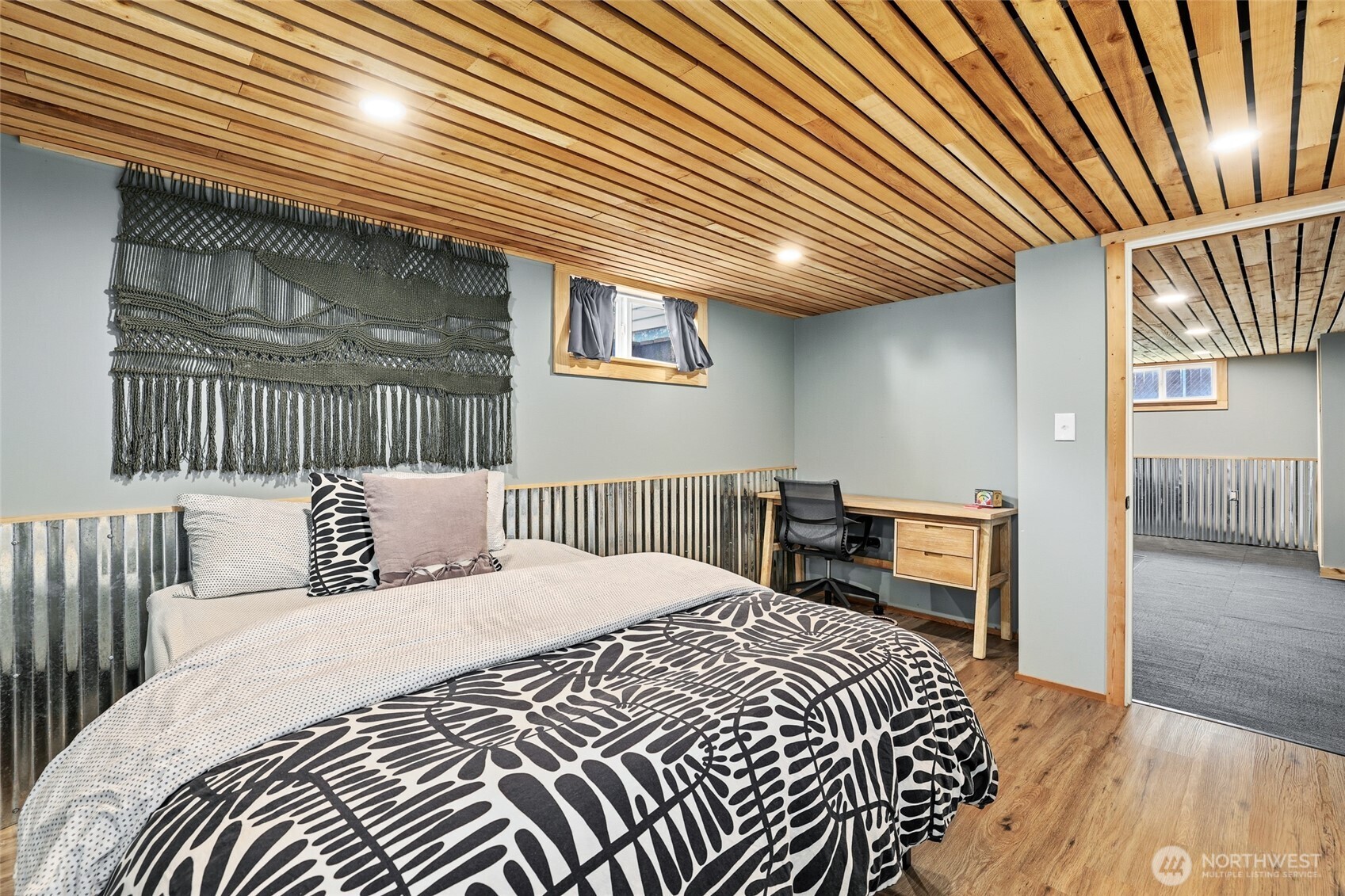 11406 12th Avenue Southwest Seattle, WA 98146 - Photo 18 of 30 a bedroom with a bed and a chandelier