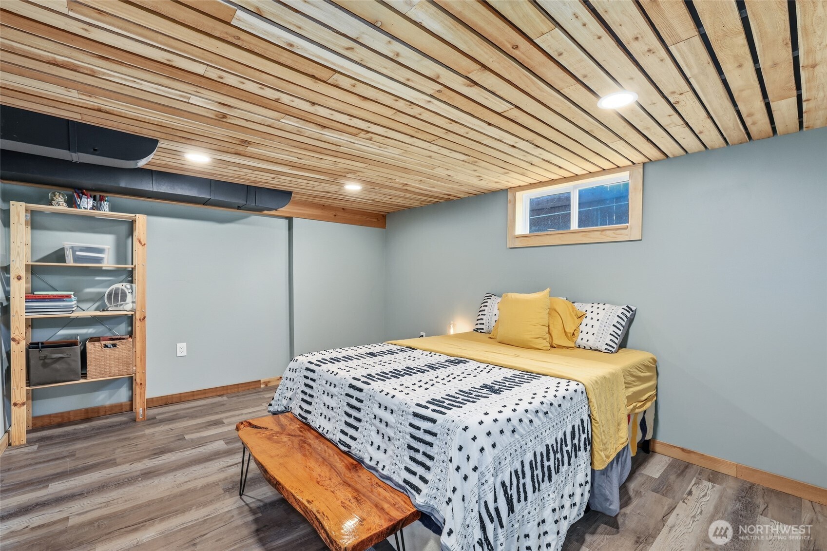 11406 12th Avenue Southwest Seattle, WA 98146 - Photo 21 of 30 a bedroom with a bed and wooden floor