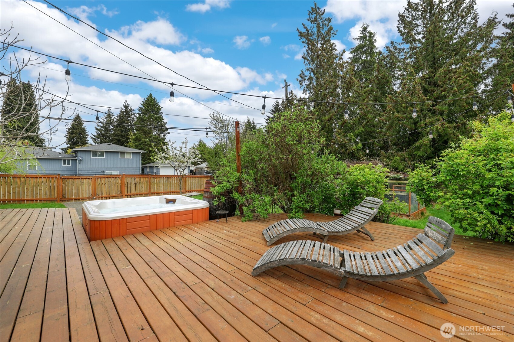 11406 12th Avenue Southwest Seattle, WA 98146 - Photo 24 of 30 a view of a wooden deck with a bench