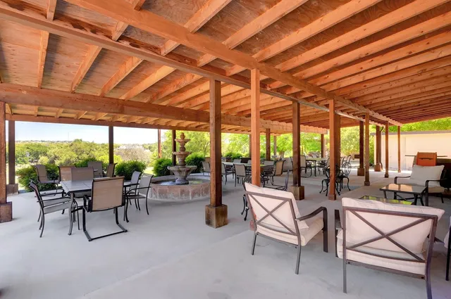 a living room with furniture and a backyard