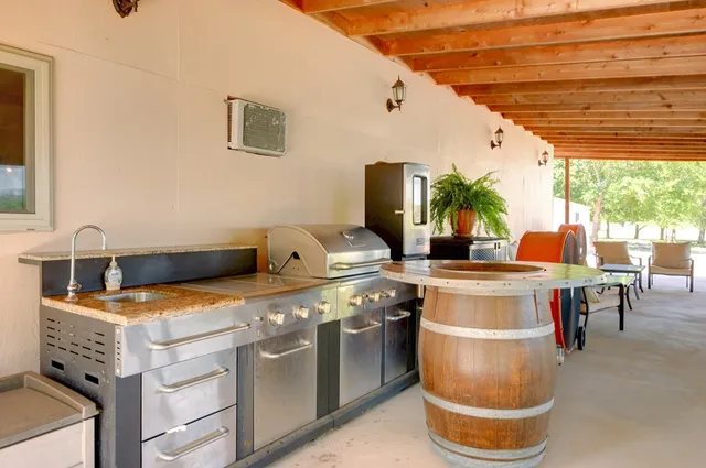 a kitchen with a stove and a white refrigerator