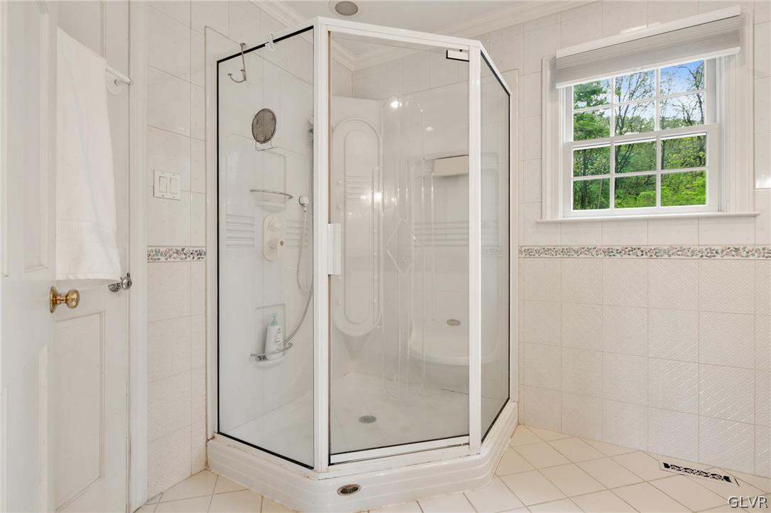 4236 Huckleberry Road Allentown, PA 18104 - Photo 31 of 39 a bathroom with a glass shower door