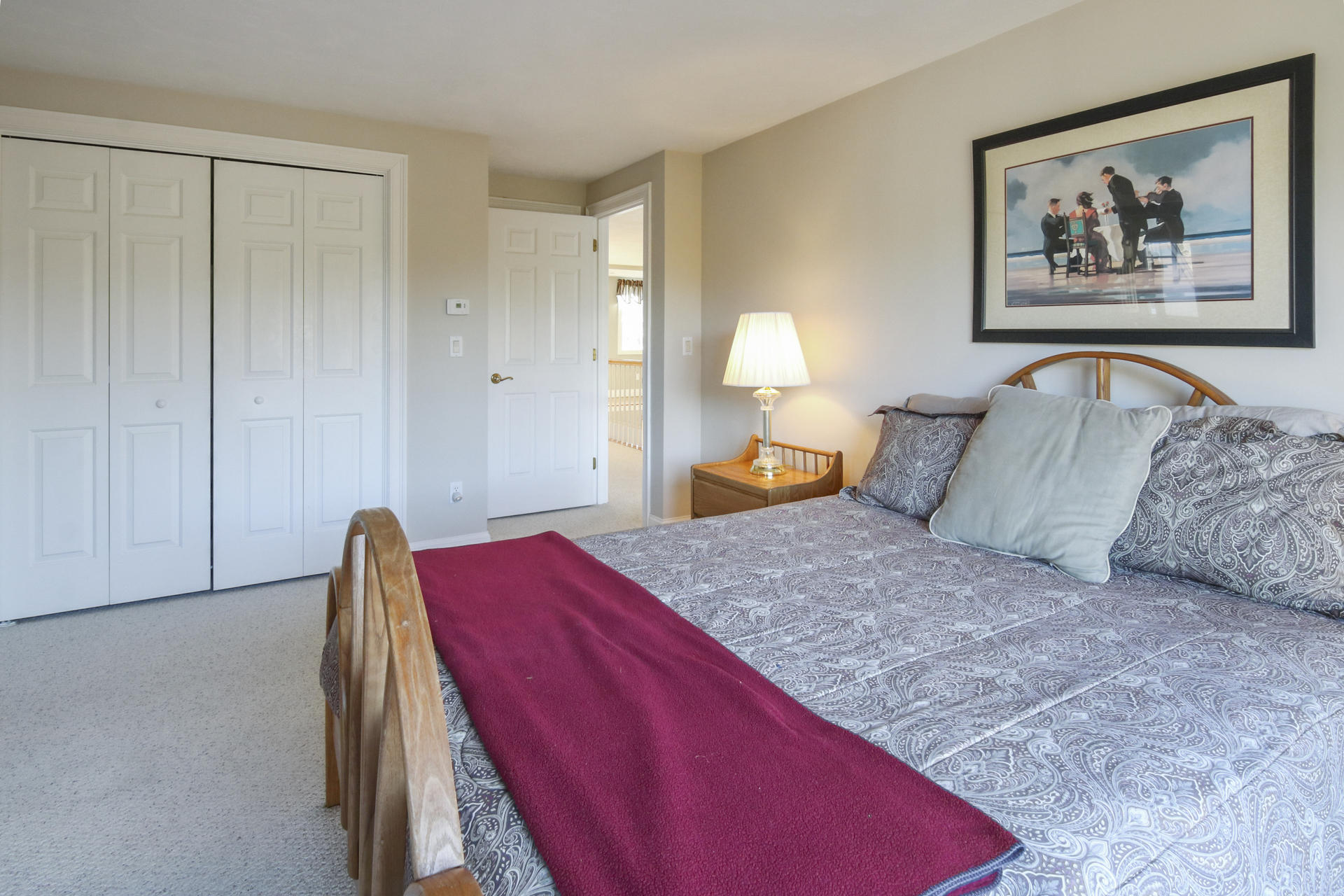 374 Cairn Ridge Road East Falmouth, MA 02536 - Photo 33 of 56 a bedroom with a bed and a painting on the wall