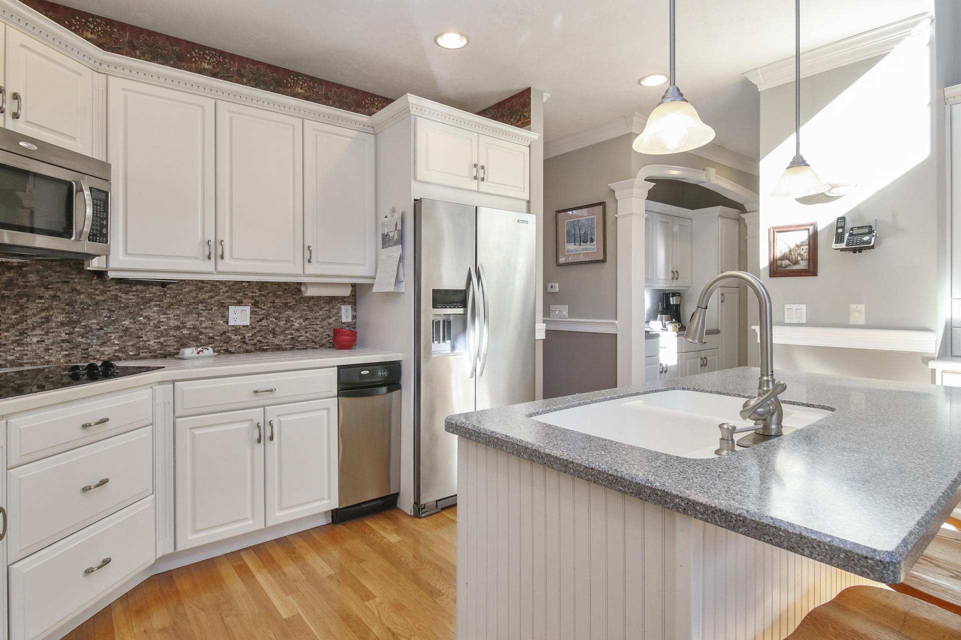 374 Cairn Ridge Road East Falmouth, MA 02536 - Photo 7 of 56 a kitchen with stainless steel appliances granite countertop a sink a stove and a refrigerator