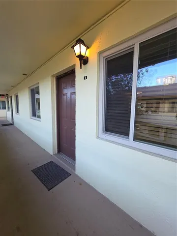 a view of a door and a window