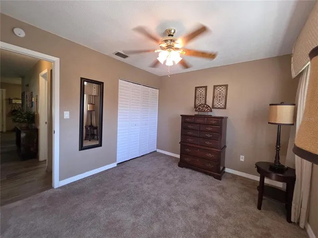 a view of room with furniture and a chandelier