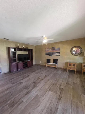 a view of a livingroom with furniture and a flat screen tv