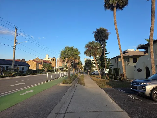 a view of a street with cars on the road