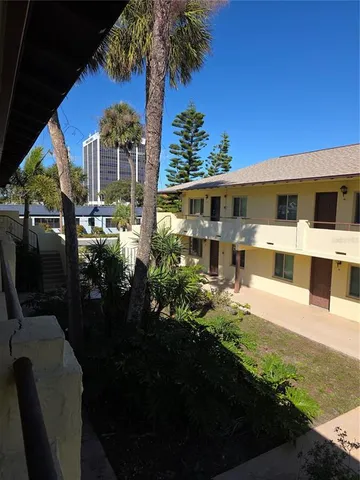 a view of house with yard