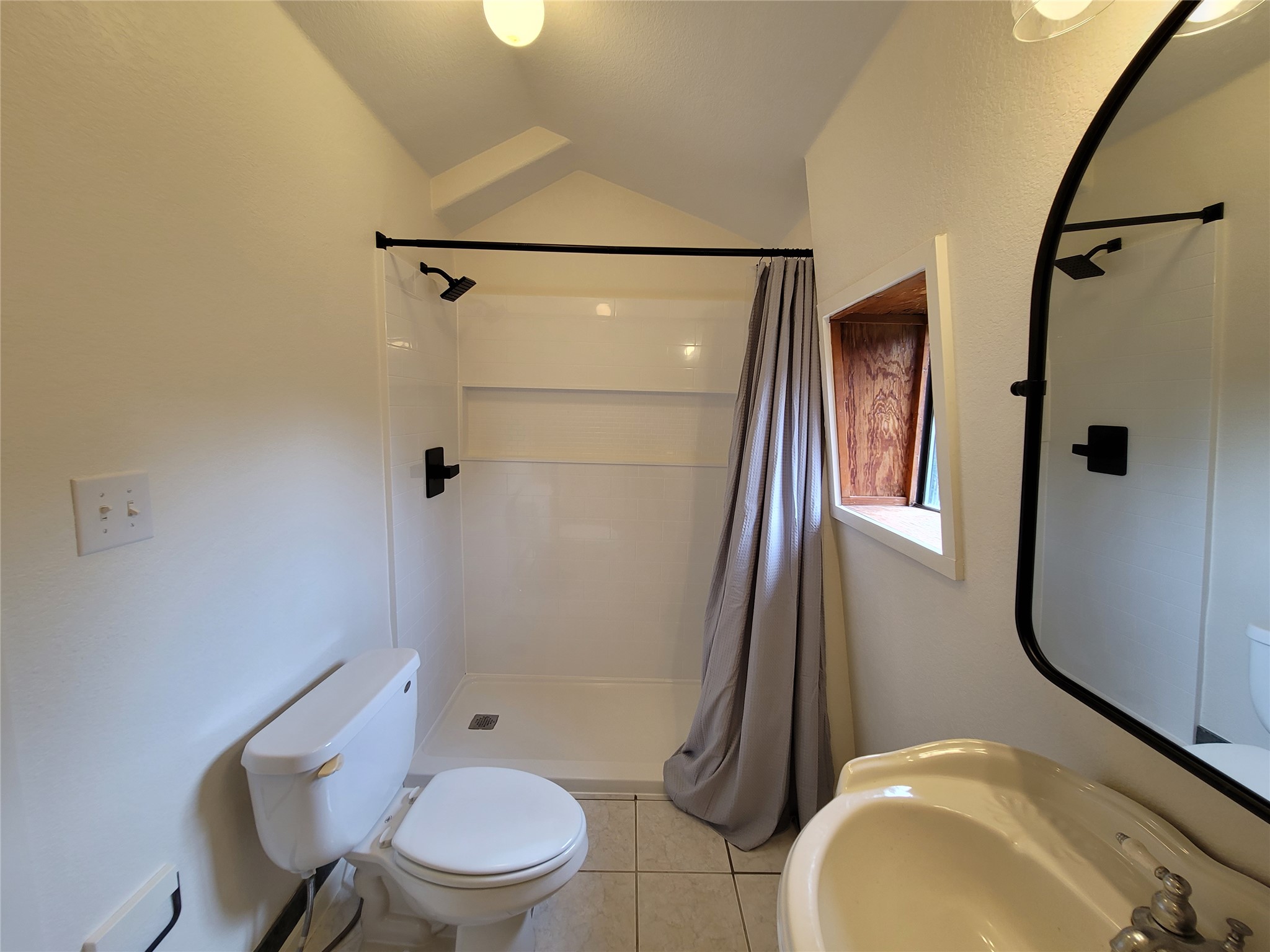 281 Earl Callahan Road, Unit A Cedar Creek, TX 78612 - Photo 28 of 39 a bathroom with a toilet and a shower