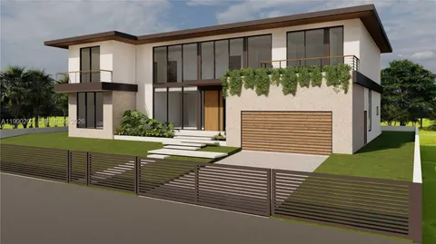 a view of a house with a small yard and plants