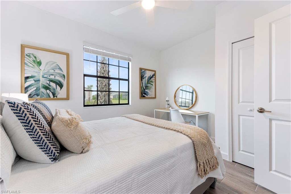 11096 Canopy Loop Fort Myers, FL 33913 - Photo 8 of 21 a bedroom with a bed and a window
