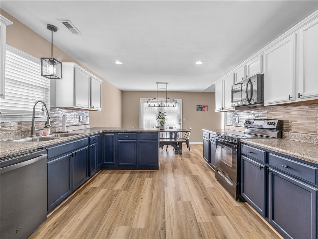 2520 Linmar Circle Anderson, SC 29621 - Photo 19 of 50 A galley kitchen with abundant counter space and modern appliances offers effortless culinary pursuits.